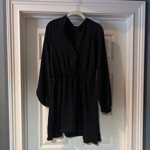 Woman’s black satin dress